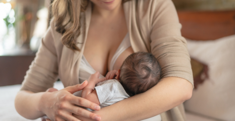 a mother breastfeeding small baby