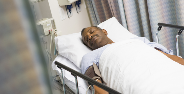 patient lying asleep in hospital bed