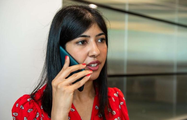 Woman holding a mobile phone to her ear
