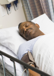 patient lying asleep in hospital bed